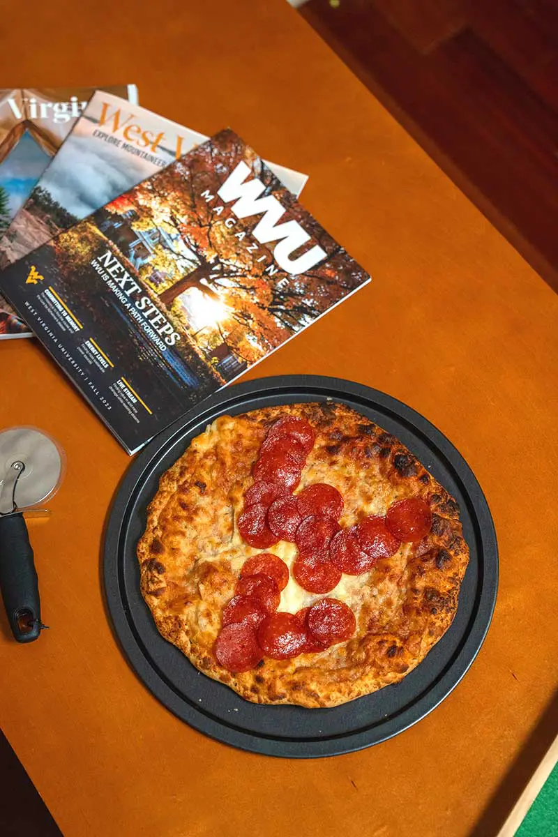 Pizza with 'WV' spelled out in pepperoni
