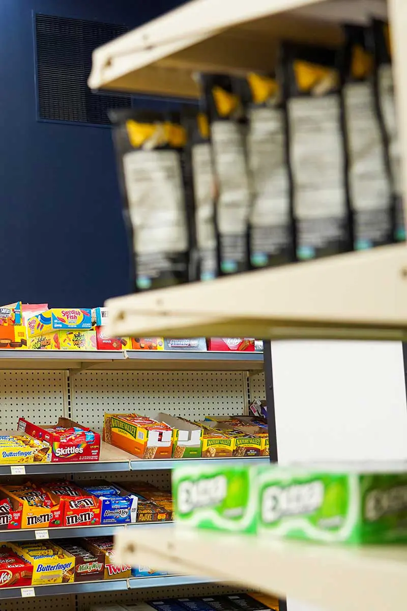 View of shelves with various snacks in market