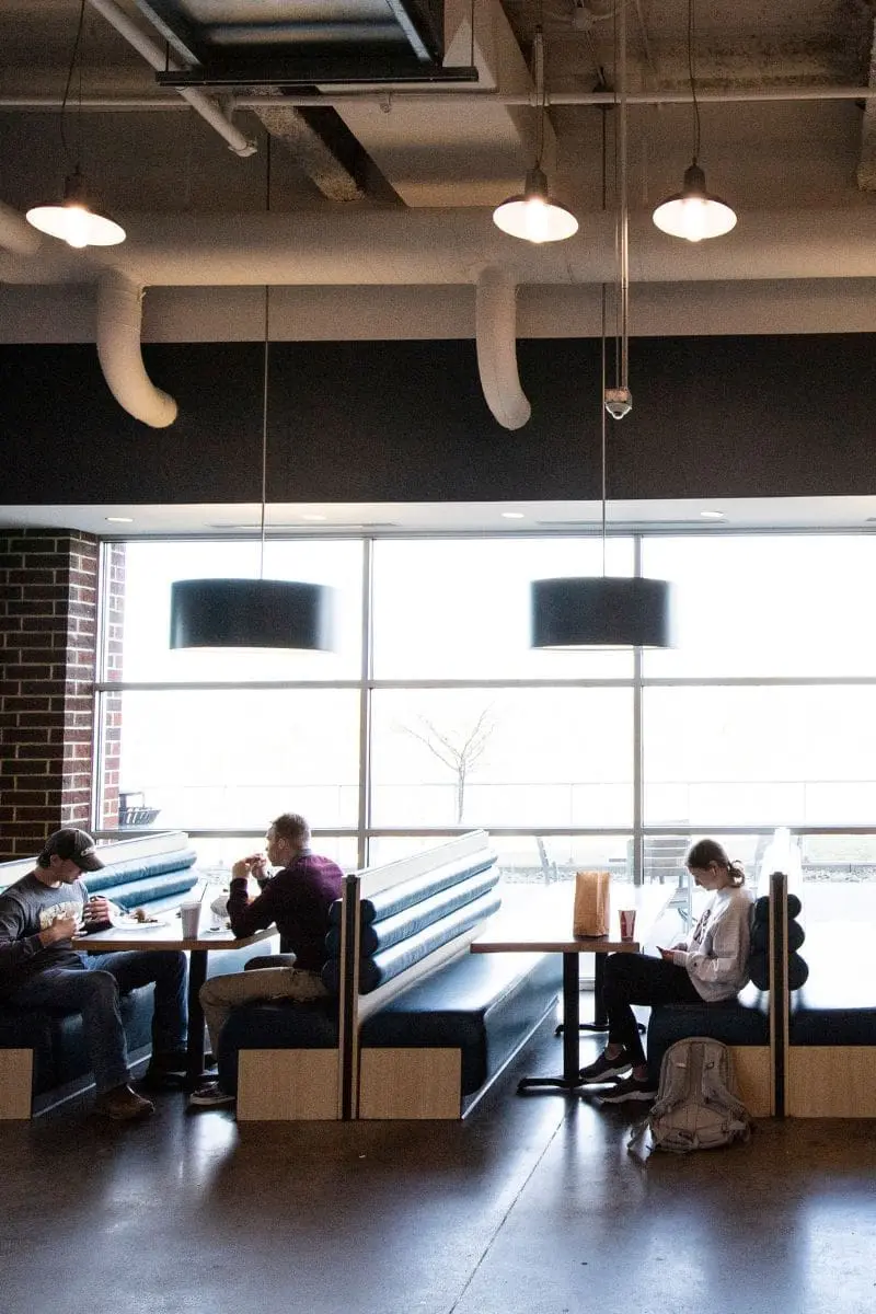 Students sitting in booths at Evansdale Crossing
